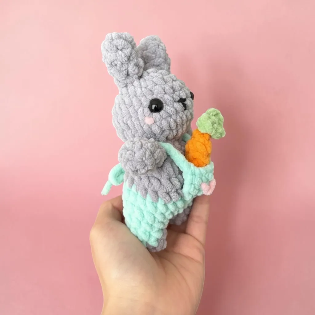 bunny in overalls with tiny carrot — image 4 of 9